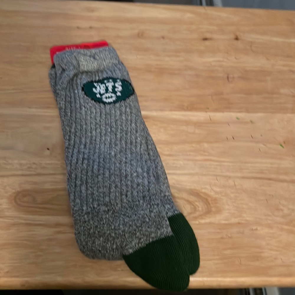 Nfl size 13 to 15 socks, gray and green